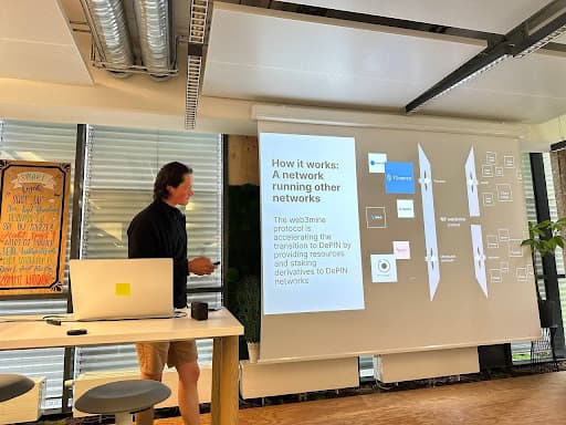 A person gives a presentation on Web3mine with a slide titled: "How it works: A network running other networks" 